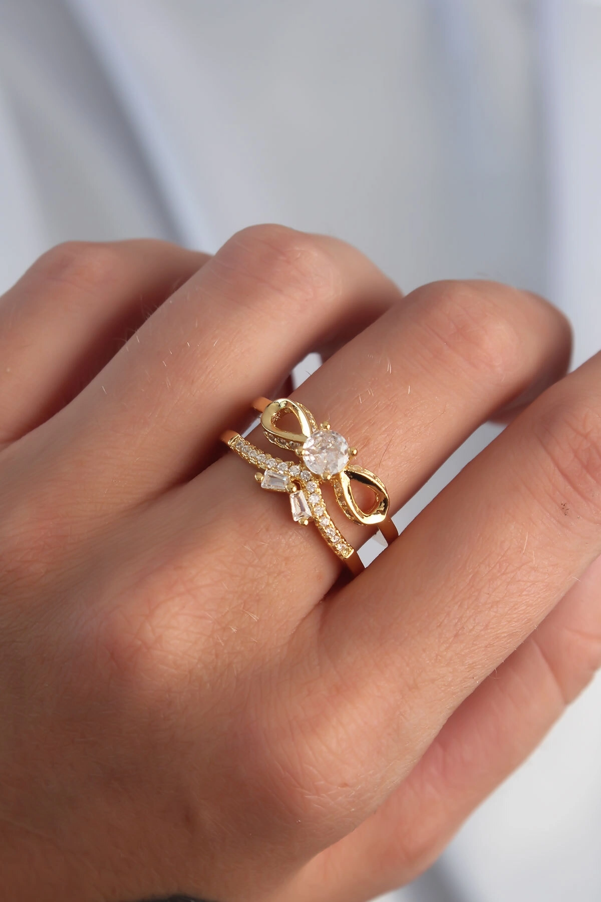 Pirinç Ayarlamalı Gold Renk Zirkon Taşlı 2li Görünüm Fiyonk Yüzük-1